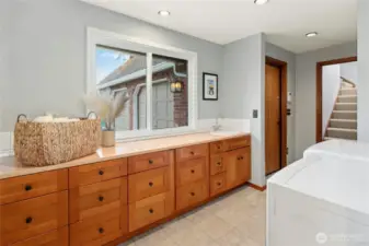 Ample counter for folding laundry and look at all of those storage drawers!