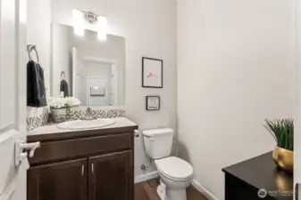 First floor powder room, convenient and not right off the family room and kitchen! Back by the garage entrance.