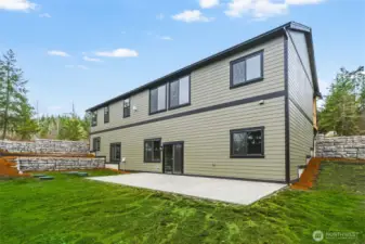 Plenty of level area in rear yard.   Grass enhancement added to photo.