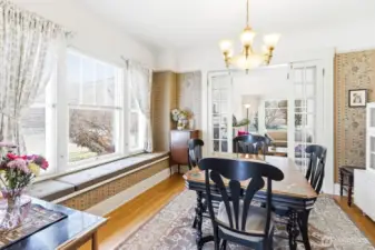 Window seat in the dining room opens up for storage space