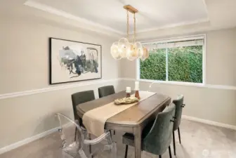 Spacious dining room with designer lighting and easily sits 8!