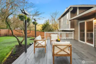 The fully fenced yard and entertaining deck create a rare backyard retreat just minutes from award-winning Tyee Middle and Newport High.