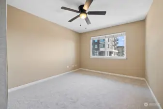 Bedroom with ceiling fan.