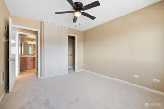 Bedroom with closet to the right and bathroom straight ahead.