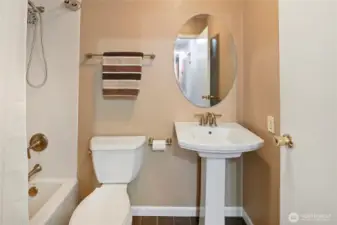 Guest bath off the main hallway. This bathroom has since been painted white.