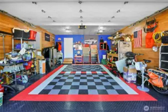 This garage is a mechanic's or craftsman's dream! The floor tiles will remain.