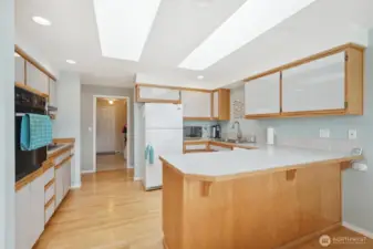 The large kitchen is open to the views and perfect for entertaining with the open concept dining room and access to the outside patio.