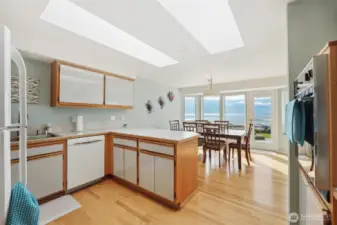 The large kitchen is open to the views and perfect for entertaining with the open concept dining room and access to the outside patio.