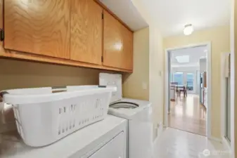 Laundry room and extra bathroom space with shower.  Rinse off after a day at the beach.