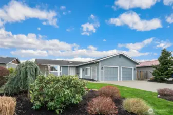 Beautiful established landscaping adds to the curb appeal.