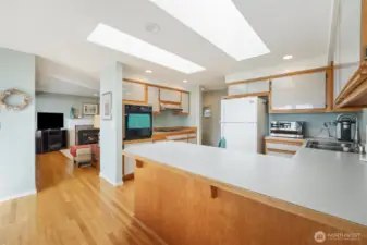 The large kitchen is open to the views and perfect for entertaining with the open concept dining room and access to the outside patio.