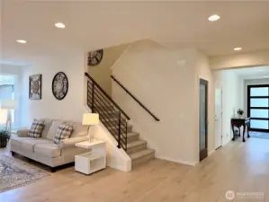 Looking at the great room staircase and front entry.