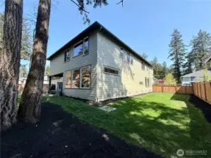Other (kitchen/dining) side of home with nice-sized side-yard.