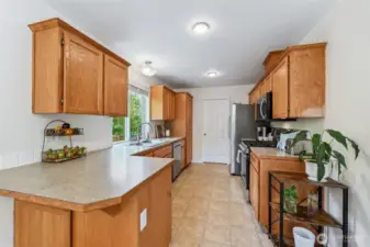 Kitchen has new dishwasher, microwave and range. Plenty of counter space for prep work.