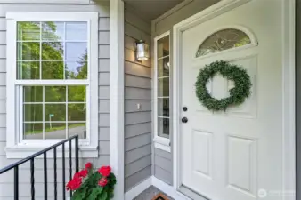 Inviting front door with landing is perfect to welcome guests to your home.