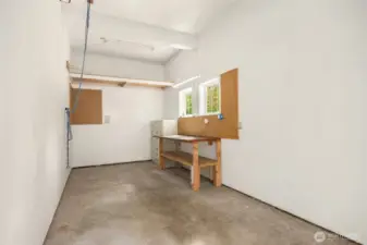 Pulley system for kayak storage and a workbench setup make this garage ready for adventure.