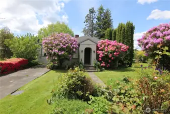 The entrance is framed by big rhodies