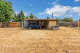 Carport integrated with the shed and covered deck