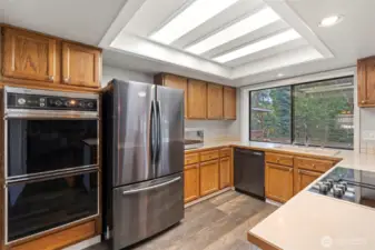 Beautifully appointed kitchen offering traditional style, practical layout, and a new downdraft stove.