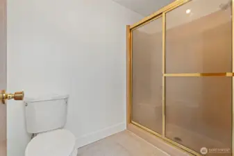 primary bathroom has seperate room with shower and new updated toilet.
