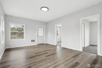 Another view inside the front door. Doors to two bedrooms or an office/hobby room.