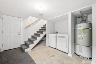 Downstairs laundry. Washer and dryer included in the sale.