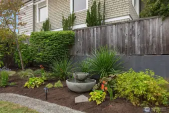Beautiful professionally landscaped garden beds, including a lovely fountain for the soothing sound of trickling water.