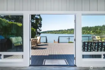 Double Doors Open to Expansive Composite Deck