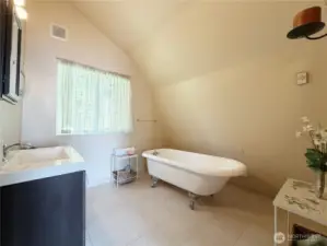 Upstairs bathroom has claw foot soaking tub