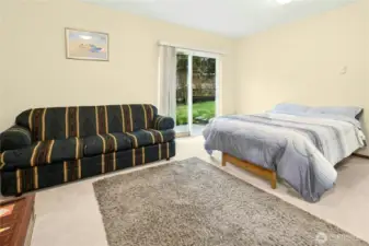 Main-level bedroom with attached full bath — ideal for guests, multi-generational living, or private office space.