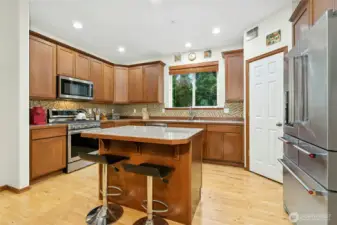 kitchen featuring newer appliances and ample prep space.