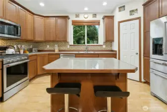 Bright kitchen with abundant cabinetry and everyday functionality.