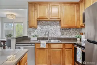 Kitchen features new stainless appliances.
