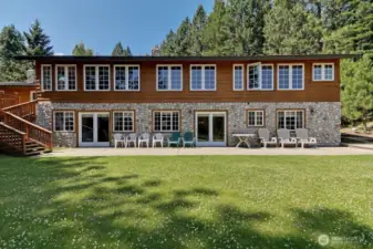 Timeless wood and river rock exterior paired with multiple access points creates a functional and inviting retreat for group living