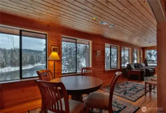 where large windows bring in natural light and showcase the serene mountain setting.