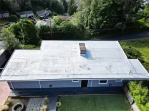 Roof newly white-coated and trim around entire roofline replaced.