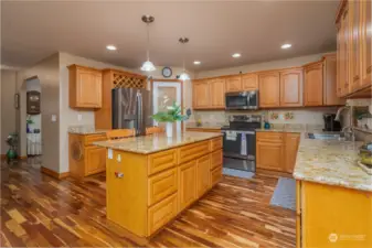 Large Kitchen w/ large Island, custom drawer inserts, pantry and wine storage above refrigerator