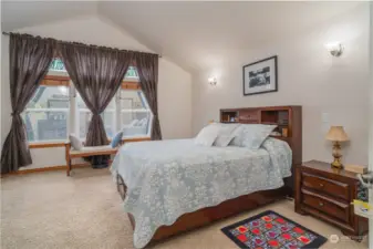 Primary bedroom offers large windows w/ natural light