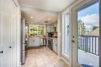 Door to backyard and deck. Pantry to left and newly remodeled kitchen.