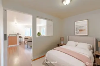 This open concept bedroom opens and feels a part of the whole place, great privacy with the barn door and the opening which has blinds for more privacy