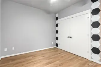 Lower level bedroom with spacious closet. Tons of storage with built in closet organizers.