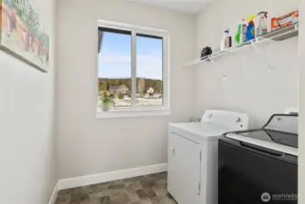 Laundry room allowing plenty of space for storage.