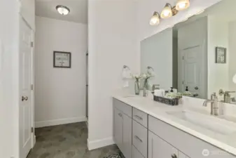 Quartz countertops with dual undermount sinks.