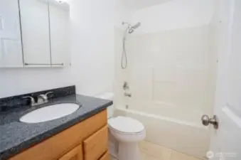Well-appointed full guest bathroom.
