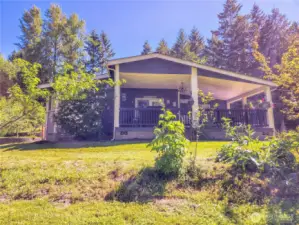 Vaulted, covered porch is sited to take in the views.