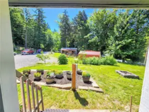 View from covered porch looking toward property entry.