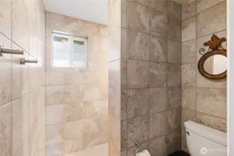Beautiful walk-in tile shower.