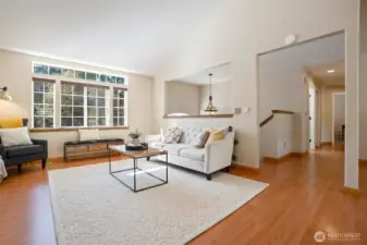 Beautiful living room with gas fireplace, large window overlooking the front yard.