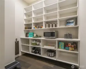 And in the corner, a dream walk in pantry! Outlets above the main shelf mean you can hide some appliances from use and keep your main kitchen stream line.