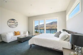 Main floor primary bedroom and en suite are spacious and filled with views, too! Prewired to add a chandelier or a ceiling fan if you so desire.